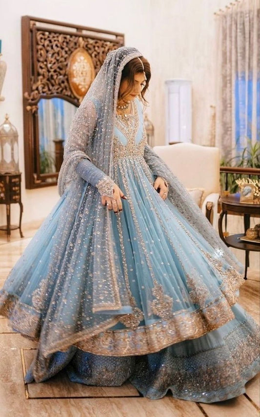 A breathtaking pastel blue bridal ensemble adorned.